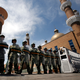 Paramilitary police stand guard across the entrance to a large mosque in the centre of Urumqi, July 9, 2009.